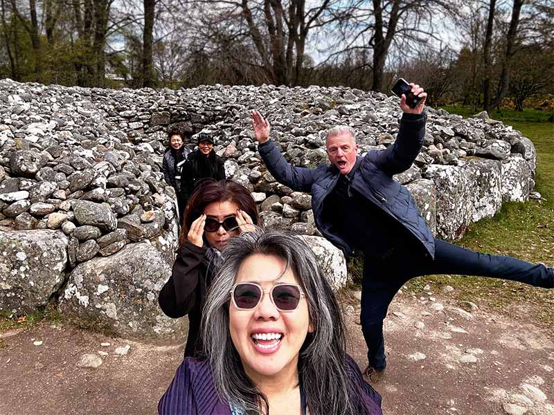 Wynding Road Tours private tour group at Clava Cairns near Inverness